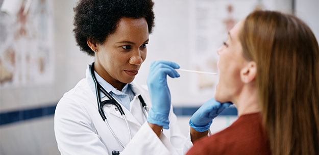 doctor performing checkup on female patient
