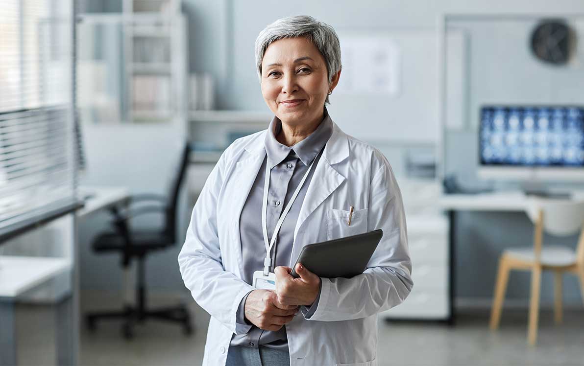 study coordinator holding tablet in a research setting