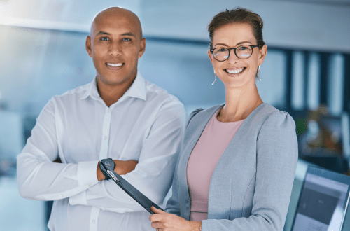 Two people from CROs standing next to each other in an office.